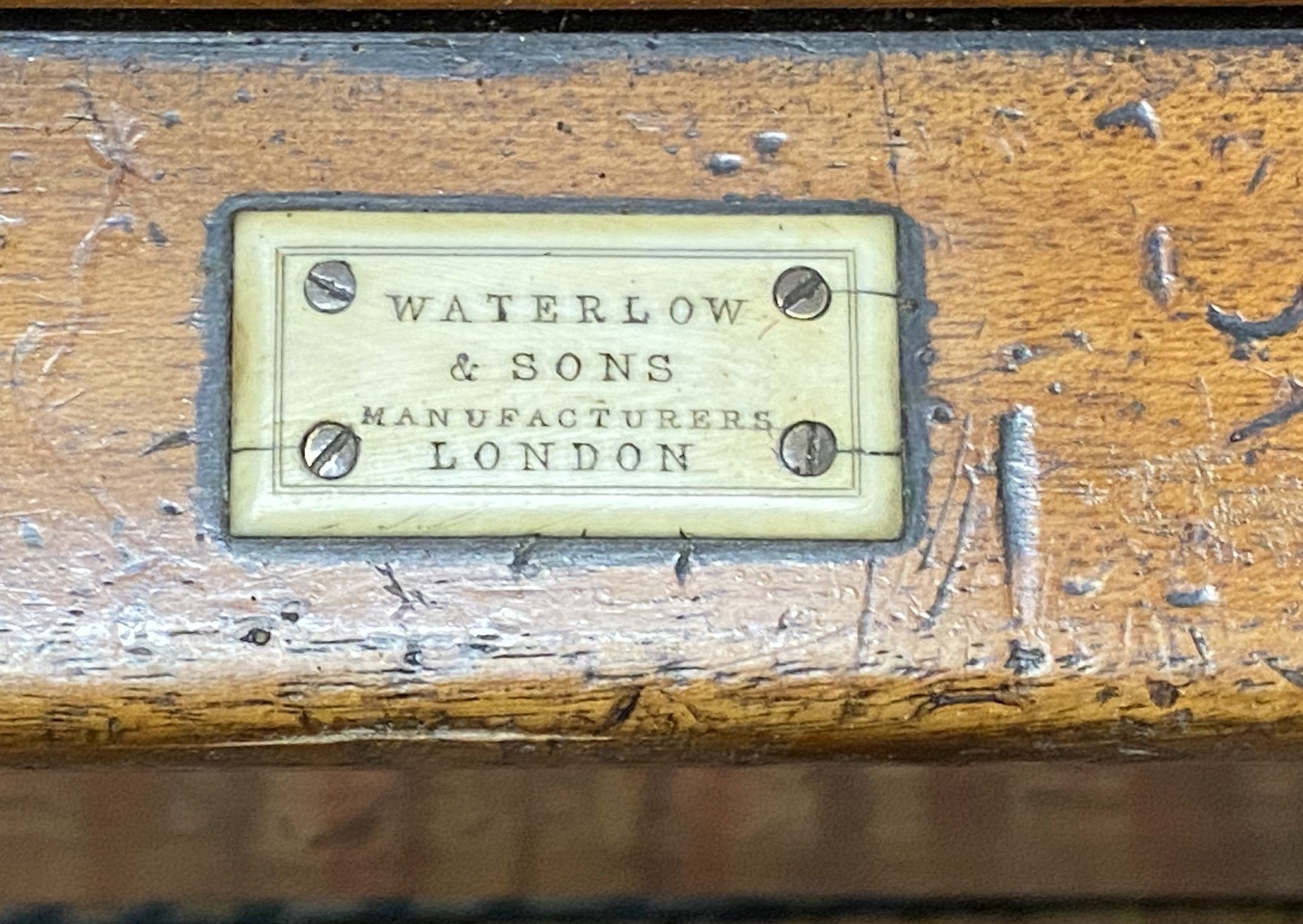 A Victorian cast iron book press on mahogany stand, marked Waterlow & Son, London, width 55cm, depth 43cm, height 118cm